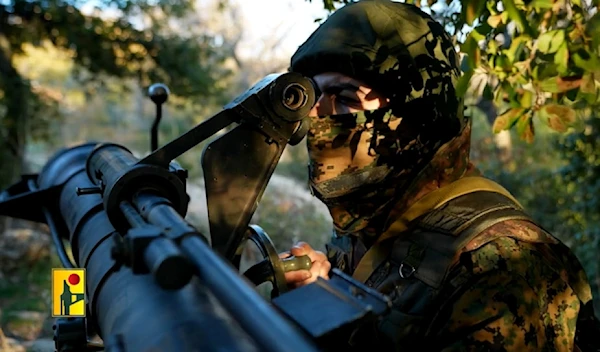 A Hezbollah fighter aims a recoilless rifle in a cinematic video published by the Military Media, on January 18,2024. (Islamic Resistance in Lebanon / Military Media)