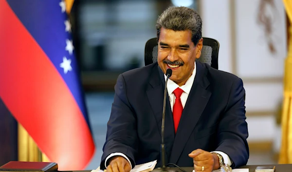 Venezuelan President Nicolas Maduro smiles during a press conference at the Miraflores presidential palace, in Caracas, Venezuela, Friday, Aug. 2, 2024. (AP)