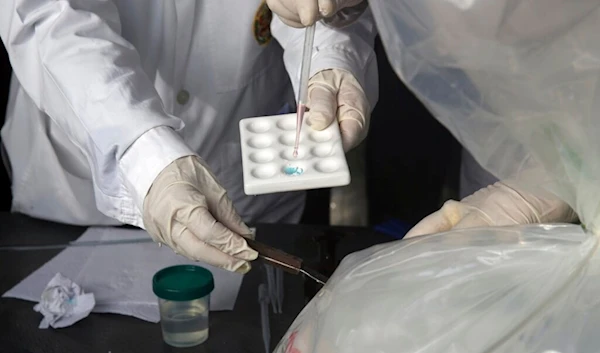 Laboratory scientists at work in Lima, Peru, Tuesday, Oct. 11, 2016. (AP)