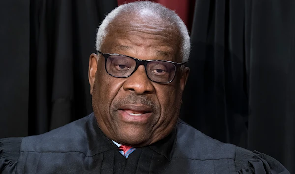 Associate Justice Clarence Thomas poses for a photo at the Supreme Court building in Washington, October 7, 2022 (AP)