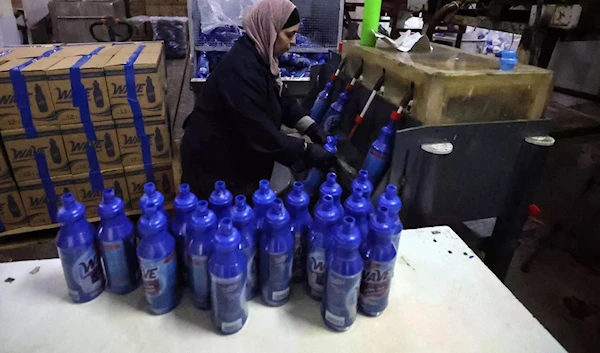 An employee working at Bishara Jubran’s household products and cosmetics factory in the occupied west bank city of Ramallah. (AFP)