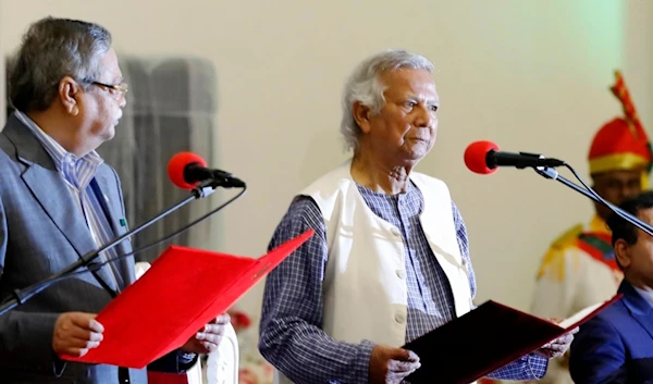 Bangladesh's figurehead President Mohammed Shahabuddin administers the oath of office to Nobel laureate Muhammad Yunus, right, as the head of Bangladesh's interim government, in Dhaka, Bangladesh, Thursday, Aug. 8, 2024. (AP)