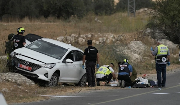 Israeli occupation forces and rescue services check the scene of a shooting operation in the West Bank city of Tarqumiyah, Sunday, Sept. 1, 2024. (AP)