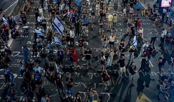 Israeli settlers protest against Prime Minister Benjamin Netanyahu's government and call for the release of captives held in the Gaza Strip, in Yaffa, occupied Palestine, Saturday, August 31, 2024 (AP)