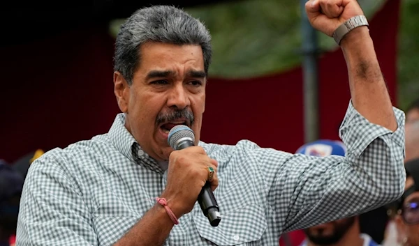 Venezuela's President Nicolas Maduro addresses crowds gathered at the presidential palace in support of his reelection one month after the presidential vote, in Caracas, Venezuela, Aug. 28, 2024. (AP)