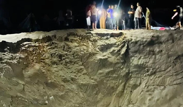 One of the craters left behind by the Israeli bombs dropped on the al-Mawasi displacement camp in Khan Younis, September 10, 2024 (Social Media)