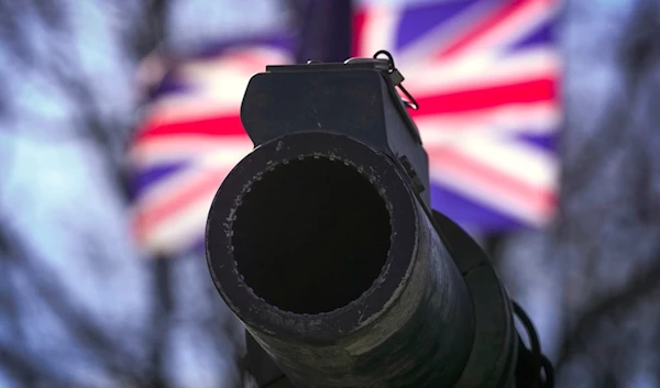 A cannon of a British Challenger 2 tank is backdropped by a UK flag during a celebration for Estonia's NATO membership 20th anniversary, in Tallinn, Estonia, Thursday, April 4, 2024. (AP)