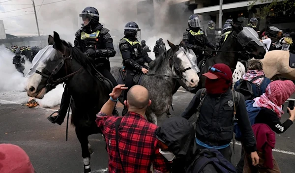 Protesters confront police outside the Land Forces 2024 arms fair in Melbourne on September 11, 2024. (AFP)