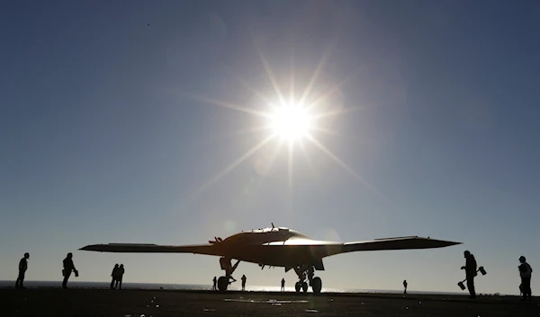 The Navy experimental unmanned aircraft, the X-47B, taxies to it's launch position on the flight deck aboard the nuclear powered aircraft carrier USS Theodore Roosevelt, off the Virginia coast, on November 10, 2013. (AP)