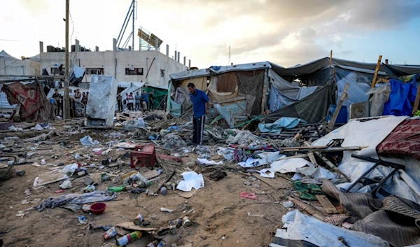 Palestinians inspect the damage at a tent area in the courtyard of Al Aqsa Martyrs Hospital, hit by an Israeli bombardment on Deir al-Balah, central Gaza Strip, Thursday, Sept. 5, 2024. (AP)