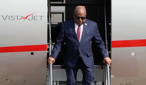 Comoros' President Azali Assoumani steps out from a plane as he arrives at the Beijing Capital International Airport to attend the China Africa Forum, in Beijing, Sunday, September 1, 2024 (AP)