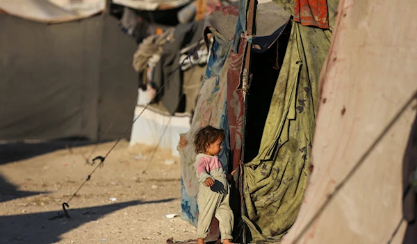 A Palestinian child living in a tent after being forcibly displaced from her home amid the Israeli genocide, September 8, 2024. (@UNRWA/ X)