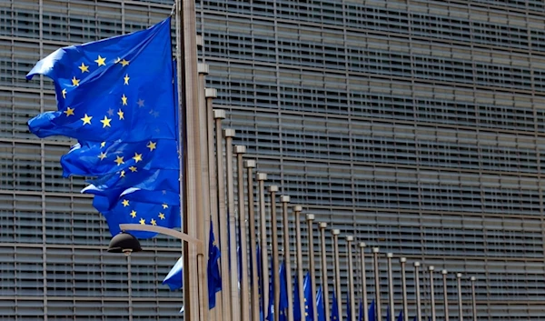 European Union flags set of half staff outside the European Commission headquarters in Brussels, Belgium, Friday, July 15, 2016. (AP)