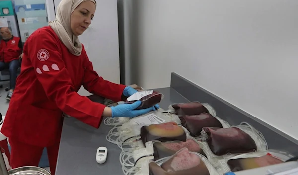 A Lebanese Red Cross volunteer collects blood donations for those who were injured by their exploded handheld pagers, Tuesday, Sept. 17, 2024, at a Red Cross center in the southern port city of Sidon, Lebanon. (AP)