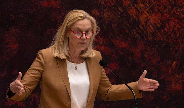 Sigrid Kaag, leader of the centrist D66 party that finished second in elections last month, right, gestures during a debate in parliament in The Hague, Netherlands, early on April 2, 2021. (AP)