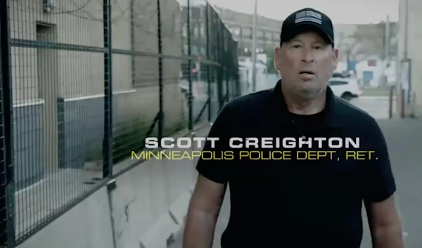 An image from video shows retired Minneapolis police officer Scott Creighton in an ad sponsored by the pro-Trump group Preserve America PAC. (Preserve America PAC)