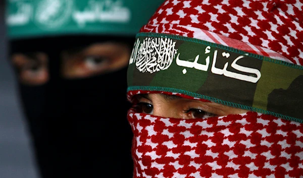 Masked Palestinian Hamas militants hold a press conference in Gaza City, on April 9, 2011. (AP)