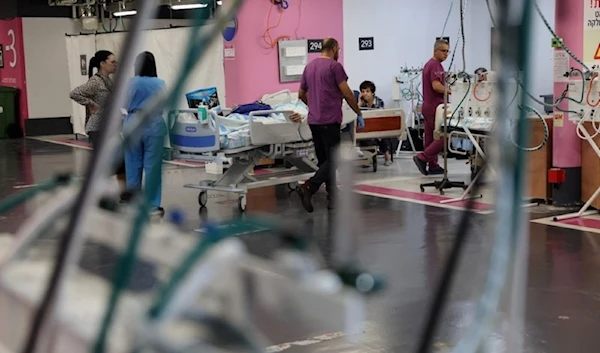 Rambam hospital workers move to a garage to work following a Hezbollah rocket attack, September 22, 2024 (AFP)