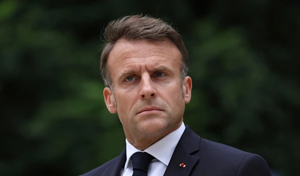 French President Emmanuel Macron reviews troops that will take part in the Bastille Day Parade on Tuesday July 2, 2024 in Paris (AP