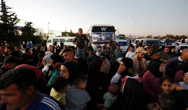 Syrians fleeing the war in Lebanon, arrive at the Syrian-Lebanese border crossing in Jdeidet Yabous, Syria, Wednesday, September 25, 2024 (AP)