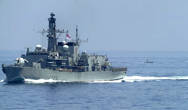 The British frigate HMS Lancaster sails as Iranian Revolution Guard vessels follow behind it in the Strait of Hormuz Friday, May 19, 2023 (AP)