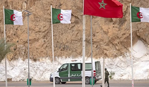 A picture taken from the Moroccan region of Oujda shows Algerian border guards patrolling along the border with Morocco on November 4, 2021 (AFP via Getty Images]