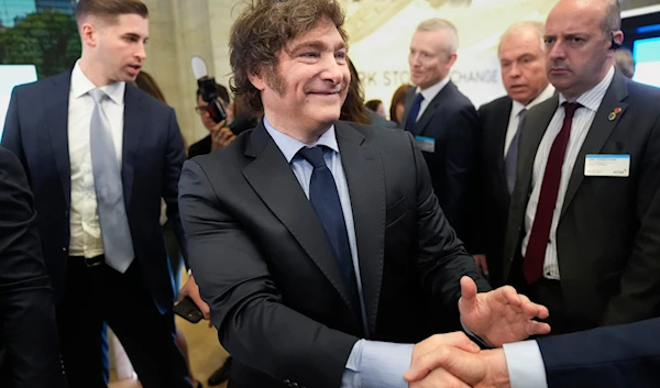 Argentina's President Javier Milei walks on the floor of the New York Stock Exchange before ringing the opening bell in New York on September 23, 2024. (AP)