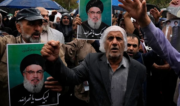 Demonstrators chant slogans as they hold posters of the leader of Lebanon's martyred Hezbollah leader Sayyed Hassan Nasrallah in the Palestine Square in downtown Tehran, Iran, Sept. 28, 2024. (AP)