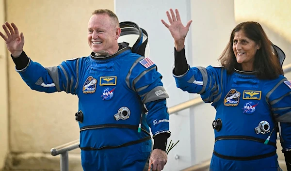 NASA astronauts Barry Wilmore and Sunita Williams wave ahead of the first Boeing Starliner crewed flight on June 5, 2024. (AFP)