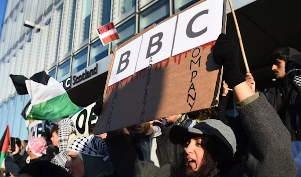 Protesters gather outside the BBC Scotland building to show solidarity with the Palestinian people, in Glasgow on October 14, 2023. (AFP)