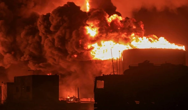 Oil tanks burn at the port in Hodeidah, Yemen, Saturday, July 20, 2024 (AP)