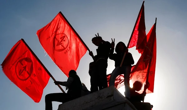 Palestinians wave flags during a rally marking the 45th anniversary of the Popular Front for the Liberation of Palestine (PFLP), in Gaza City, Thursday, Dec. 6, 2012. (AP)