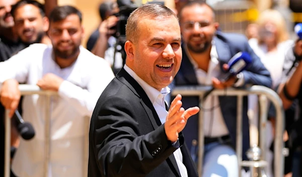 Lebanese lawmaker Hassan Fadlallah leaves the parliament building after he attends a parliament session in Beirut, Lebanon, Wednesday, June 14, 2023 (AP)