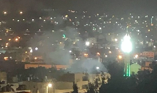 Smoke rises as the Palestinian Resistance targets invading IOF with an explosive device amid confrontations in the Old Askar camp in Nablus, occupied West Bank, on September 30, 2024. (Social media)