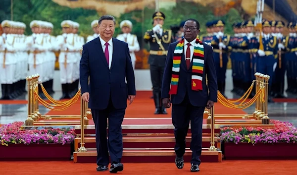 Chinese leader Xi Jinping and Zimbabwe's President Emmerson Mnangagwa review an honor guard during a welcome ceremony at the Great Hall of the People in Beijing ahead of the Forum on China and Africa Cooperation, on September 2, 2024. (AP)