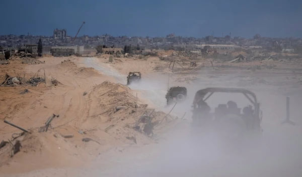 Israeli occupation forces vehicles transport a group of Israeli occupation soldiers and journalists inside the southern Gaza Strip, Palestine, July 3, 2024. (AP)