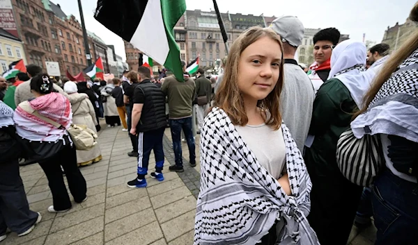 Climate activist Greta Thunberg takes part in a Stop Israel demonstration, between Stortorget and Mölleplatsen in Malmo, Sweden. (AFP)