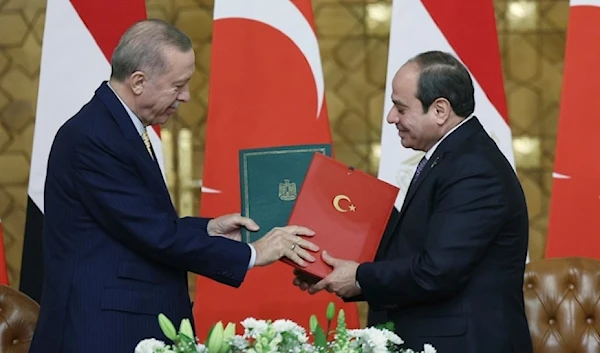 Egyptian President Abdel Fattah el-Sisi and Turkish President Recep Tayyip Erdogan exchange signed agreements following their meeting in Cairo, Egypt. Feb. 14, 2024 (AP)