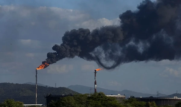 Gas is flared at the Jose Antonio Anzoategui oil complex in Barcelona, Anzoategui state, Venezuela, January 9, 2024 (AP)