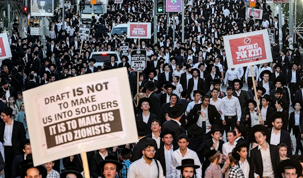 Ultra-Orthodox Jewish demonstrators gather for a protest against a ruling by the Israeli High Court that they must be drafted into military service, June 30, 2024. (AFP)