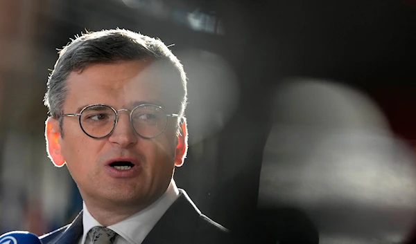 Ukraine's Foreign Minister Dmytro Kuleba speaks with the media as he arrives for a meeting of EU foreign ministers at the European Council building in Brussels, Thursday, Aug. 29, 2024.