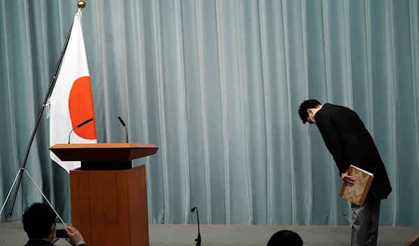 Shinjiro Koizumi, Minister of the Environment, bows before speaking during a press conference at the prime minister's official residence on September 17, 2020, in Tokyo. (AP)