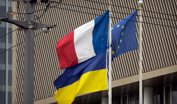 The flags of France, Ukraine, and the European Union fly at the French Embassy in Beijing, Wednesday, May 17, 2023.  (AP)