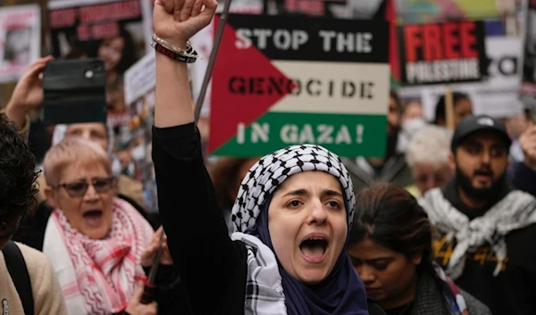 Pro-Palestinian protesters take part in a demonstration on al-Quds Day, in London, Friday, April 5, 2024 (AP)