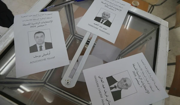 Ballots showing the three presidential candidates are placed on a table inside a polling station during the presidential election, September 7, 2024, in Algiers, Algeria (AP)