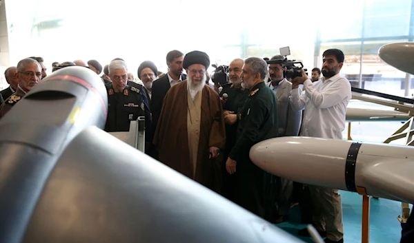 Iranian Leader Ayatollah Ali Khamenei, center, visits an exhibition of the Revolutionary Guard's aerospace achievements as he is accompanied by the armed forces commanders, in Iran, Sunday, November 19, 2023 (AP)