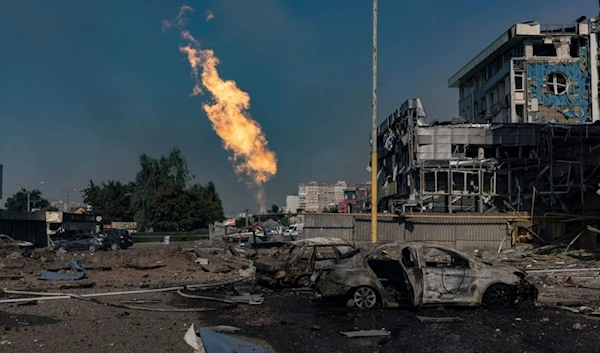 Gas burns in front of a business center damaged by a Russian attack in Kharkiv, Ukraine, Sunday, Sept. 1 2024. (AP Photo/Yevhen Titov)