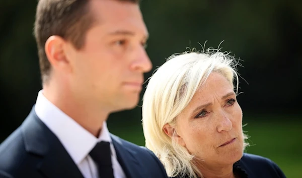 French far-right leader Marine Le Pen and National Rally president Jordan Bardella answer journalists after a meeting with French President Emmanuel Macron, Monday, August 26, 2024, at the Elysee Palace in Paris (AP)