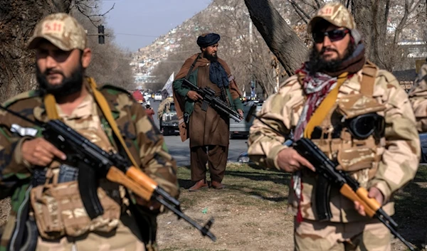 FILE - Taliban fighters stand guard in Kabul, Afghanistan, on Dec. 26, 2022. (AP Photo/Ebrahim Noroozi, File)