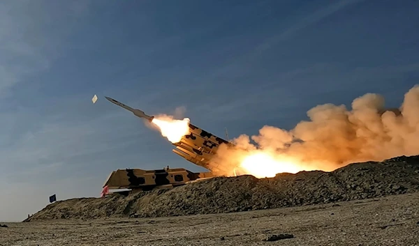 In this photo released by the Iranian Army on Friday, Jan. 19, 2024, a missile is launched during a military drill in southern Iran (AP)